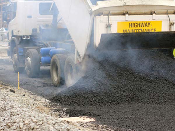 Pulverizing Equipment Dumping Asphalt