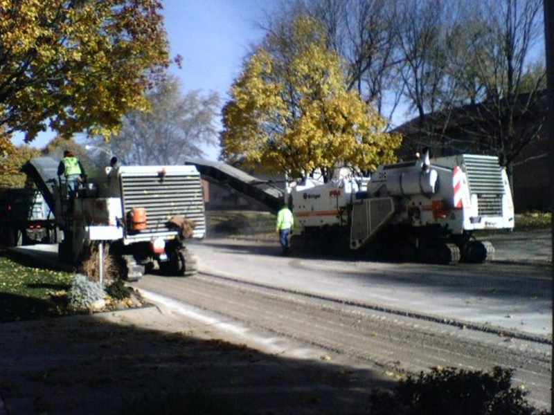Crew using milling Equipment working on road
